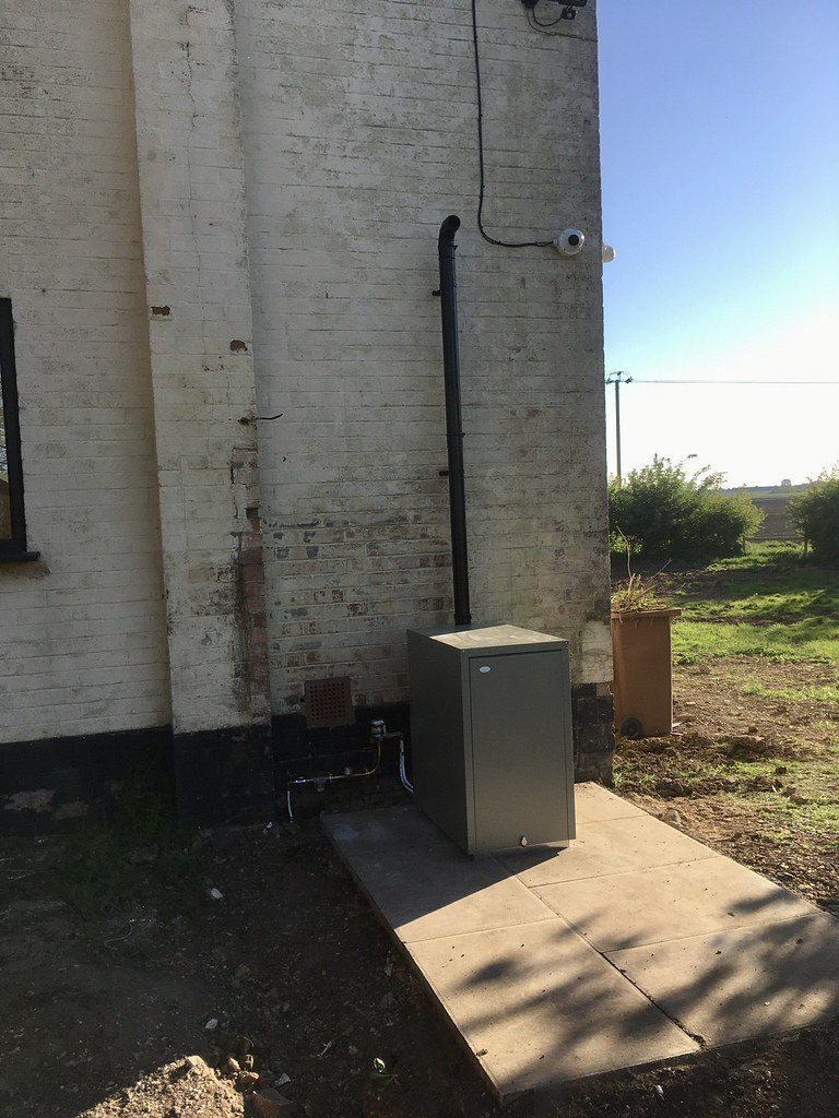 Real Grant Vortex external weatherproof oil boiler cabinet in Scottish home